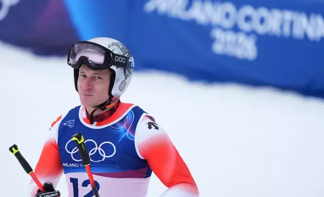 Switzerland's Marco Odermatt reacts at the finish area of an alpine ski, men's downhill official training, at the 2026 Winter Olympics, in Bormio, Italy, Friday, Feb. 6, 2026. (AP Photo/Rebecca Blackwell)