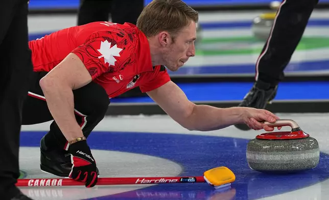 Canada's Marc Kennedy in action during the men's curling round robin session against Britain at the 2026 Winter Olympics, in Cortina d'Ampezzo, Italy, Tuesday, Feb. 17, 2026. (AP Photo/Fatima Shbair)