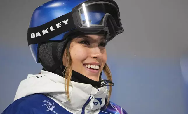China's Eileen Gu smiles during the women's freestyle skiing halfpipe qualifications at the 2026 Winter Olympics, in Livigno, Italy, Thursday, Feb. 19, 2026. (AP Photo/Lindsey Wasson)