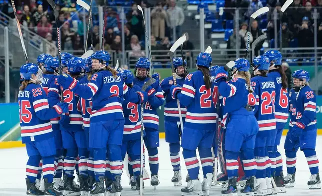 U.S. players celebrate after a semifinal match of women's ice hockey between the United States and Sweden at the 2026 Winter Olympics, in Milan, Italy, Monday, Feb. 16, 2026. (AP Photo/Petr David Josek)