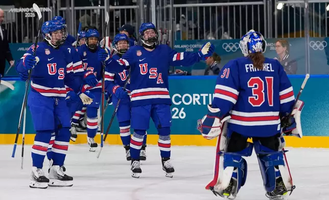 United States' Aerin Frankel, right, celebrates with teammates after a preliminary round match of women's ice hockey between the United States and Finland at the 2026 Winter Olympics, in Milan, Italy, Saturday, Feb. 7, 2026. (AP Photo/Petr David Josek)