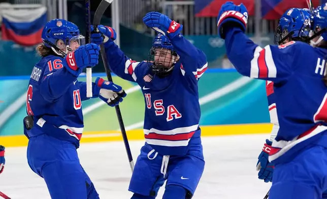 United States' Hayley Scamurra, left, celebrates after scoring her side's fifth goal during a preliminary round match of women's ice hockey between United States and Czechia at the 2026 Winter Olympics, in Milan, Italy, Thursday, Feb. 5, 2026. (AP Photo/Petr David Josek)