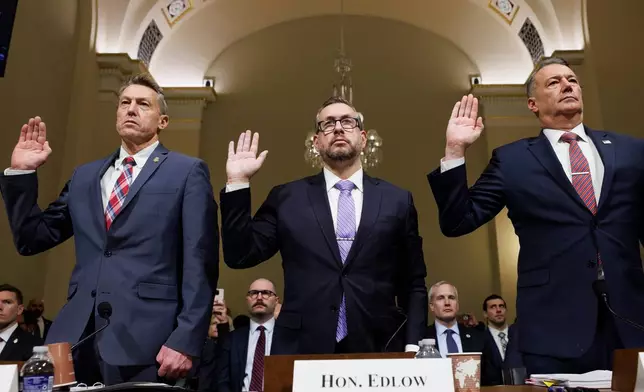 From left, Rodney Scott, commissioner of U.S. Customs and Border Protection, Joseph Edlow, director of U.S. Citizenship and Immigration Services and Todd Lyons, acting director of the U.S. Immigration and Customs Enforcement, are sworn in during a House Committee on Homeland Security oversight hearing of the Department of Homeland Security: ICE CBP and USCIS, on Capitol Hill, Tuesday, Feb. 10, 2026, in Washington. (AP Photo/Tom Brenner)