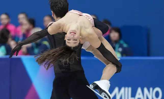 Laurence Fournier Beaudry and Guillaume Cizeron of France compete during the figure skating ice dance team event at the 2026 Winter Olympics, in Milan, Italy, Friday, Feb. 6, 2026. (AP Photo/Stephanie Scarbrough)