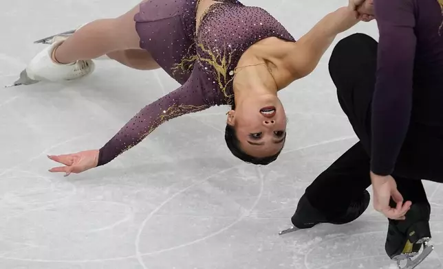 Ellie Kam and Danny O'Shea of the United States compete during the figure skating pairs team event at the 2026 Winter Olympics, in Milan, Italy, Friday, Feb. 6, 2026. (AP Photo/Ashley Landis)