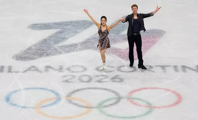 Madison Chock and Evan Bates of the United States compete during the figure skating ice dance team event at the 2026 Winter Olympics, in Milan, Italy, Friday, Feb. 6, 2026. (AP Photo/Ashley Landis)