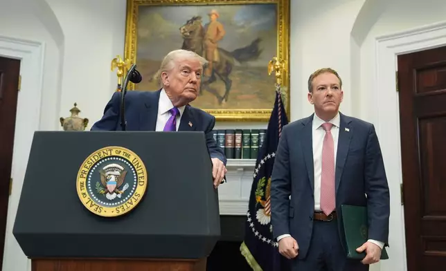 President Donald Trump listens to a question from a reporter during an event with Environmental Protection Agency director Lee Zeldin to announce the EPA will no longer regulate greenhouse gases, in the Roosevelt Room of the White House, Thursday, Feb. 12, 2026, in Washington. (AP Photo/Evan Vucci)
