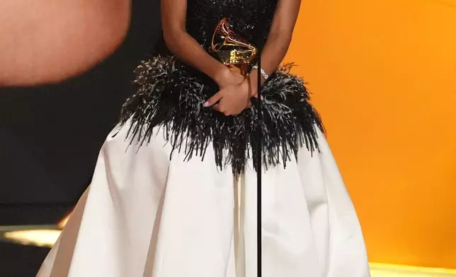 Olivia Dean accepts the award for best new artist during the 68th annual Grammy Awards on Sunday, Feb. 1, 2026, in Los Angeles. (AP Photo/Chris Pizzello)