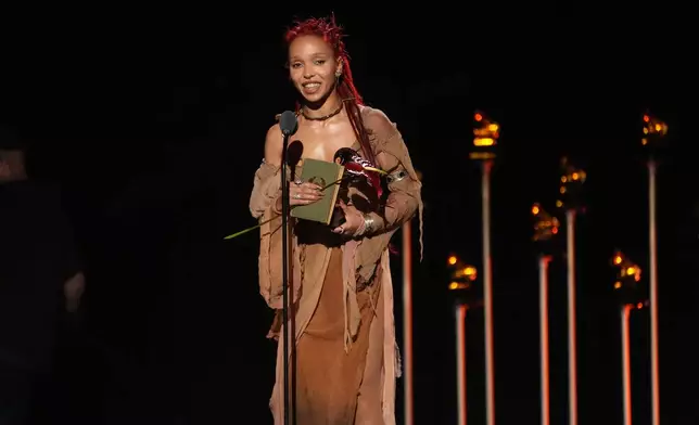FKA Twigs accepts the award for best dance/electronic album for "EUSEXUA" during the 68th annual Grammy Awards on Sunday, Feb. 1, 2026, in Los Angeles. (AP Photo/Chris Pizzello)