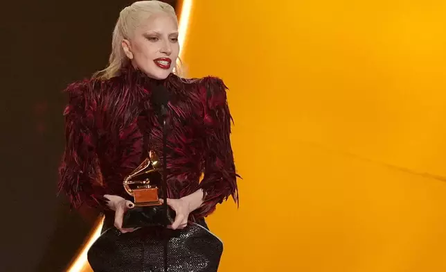 Lady Gaga accepts the award for best pop vocal album for "Mayhem" during the 68th annual Grammy Awards on Sunday, Feb. 1, 2026, in Los Angeles. (AP Photo/Chris Pizzello)