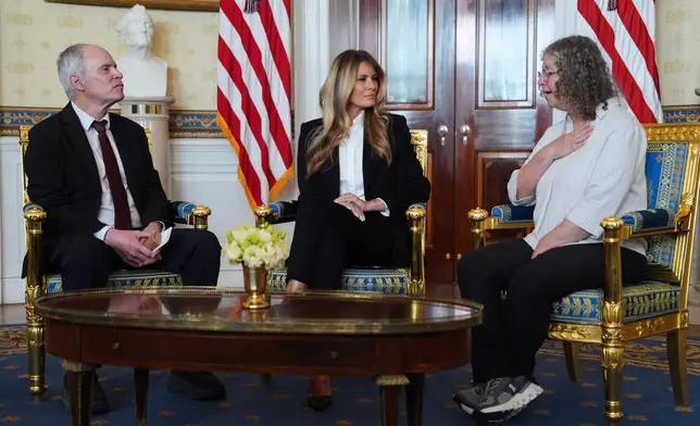 First lady Melania Trump meets with freed American-Israeli hostage Keith Siegel and his wife Aviva at the White House, Wednesday, Feb. 4, 2026, in Washington. (AP Photo/Evan Vucci)