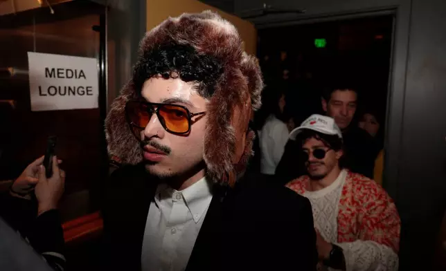 Contestants line up at the Bad Bunny look-alike contest line up at Tacolicious in San Francisco, Thursday, Feb. 5, 2026. (Giselle Garza Lerma/San Francisco Chronicle via AP)