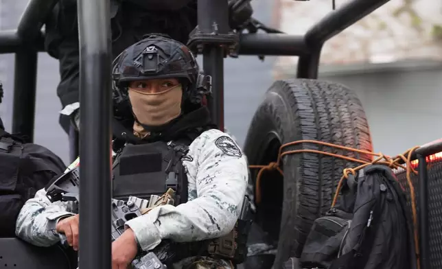 A National Guard patrols the area outside of the General Prosecutor's headquarters in Mexico City, Sunday, Feb. 22, 2026, after authorities reported that the Mexican Army killed Jalisco New Generation Cartel leader Nemesio Oseguera, known as "El Mencho." (AP Photo/Ginette Riquelme)