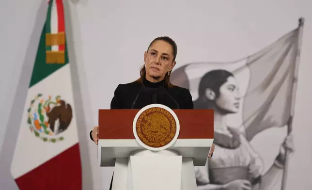 Mexican President Claudia Sheinbaum gives her the daily, morning news conference at the National Palace in Mexico City, Monday, Feb. 23, 2026, the day after the Mexican army killed Jalisco New Generation Cartel leader Nemesio Oseguera Cervantes, known as "El Mencho." (AP Photo/Ginnette Riquelme)