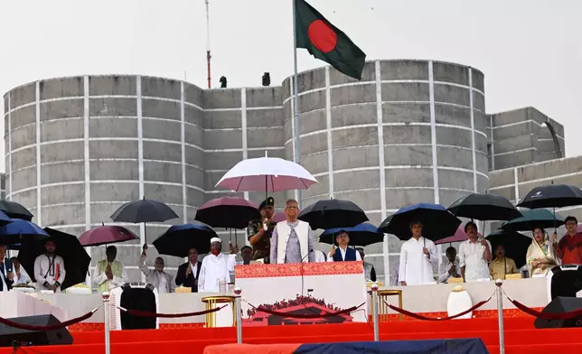 FILE - Head of the Bangladesh's interim government and Nobel laureate Dr. Muhammad Yunus attends an event during where the signing of a political charter called July National Charter was announced, outside Bangladesh's national parliament complex in Dhaka, Bangladesh, on Oct. 17, 2025. (AP Photo/Mahmud Hossain Opu, File)