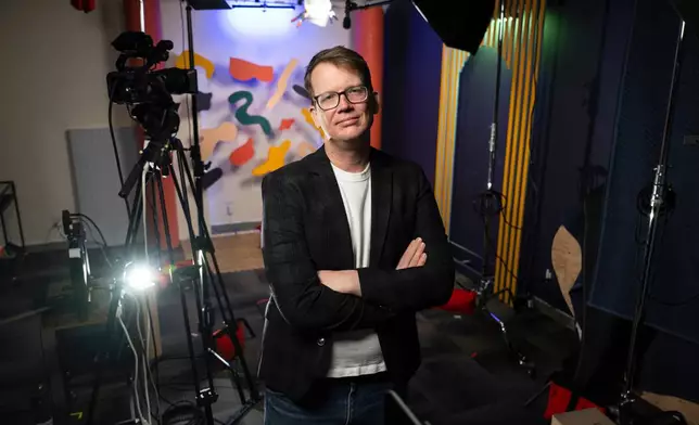 Hank Green sits for a portrait at his studio in Missoula, Mont., on Tuesday, Jan. 27, 2026. (AP Photo/Tommy Martino)