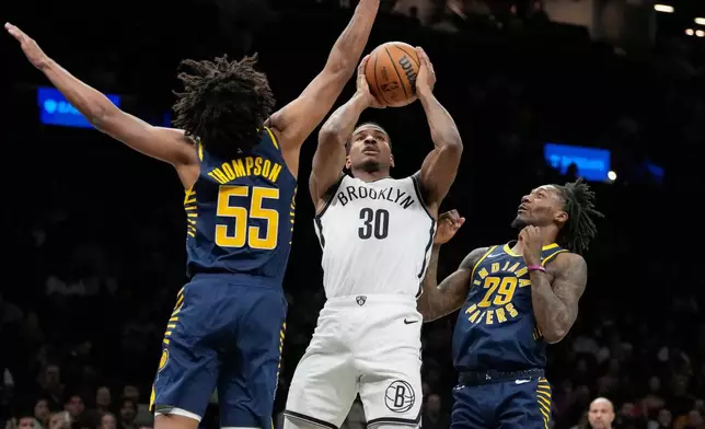 Brooklyn Nets guard Ochai Agbaji shoots during the second half of an NBA basketball game against the Indiana Pacers, Wednesday, Feb. 11, 2026, in New York. (AP Photo/Yuki Iwamura)