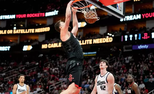 Houston Rockets center Alperen Sengun sucks against the Sacramento Kings during the second half of an NBA basketball game, Wednesday, Feb. 25, 2026, in Houston. (AP Photo/Eric Christian Smith)