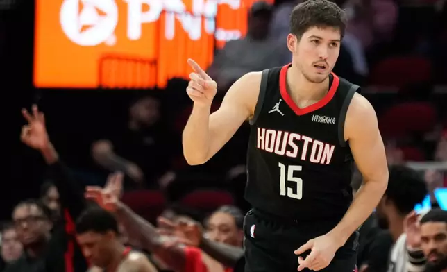 Houston Rockets guard Reed Sheppard reacts after making a 3-point basket against the Sacramento Kings during the first half of an NBA basketball game, Wednesday, Feb. 25, 2026, in Houston. (AP Photo/Eric Christian Smith)
