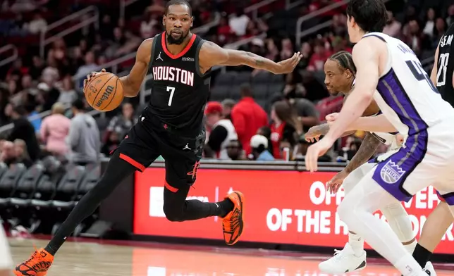 Houston Rockets forward Kevin Durant (7) dribbles against the Sacramento Kings during the second half of an NBA basketball game, Wednesday, Feb. 25, 2026, in Houston. (AP Photo/Eric Christian Smith)