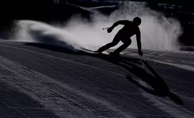 Austria's Daniel Hemetsberger comes into the finish area of an alpine ski men's downhill portion of a team combined race, at the 2026 Winter Olympics, in Bormio, Italy, Feb. 9, 2026. (AP Photo/Rebecca Blackwell, File)