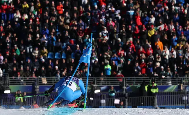 Italy's Federica Brignone speeds down the course on her way to win an alpine ski, women's giant slalom race, at the 2026 Winter Olympics, in Cortina d'Ampezzo, Italy, Feb. 15, 2026. (AP Photo/Marco Trovati, File)