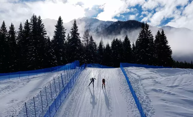 Athletes participate in a biathlon training session at the 2026 Winter Olympics in Anterselva, Italy, Feb. 6, 2026. (AP Photo/Mosa'ab Elshamy, File)