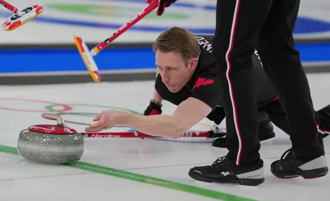 Canada's Marc Kennedy in action during the men's curling round robin session against Sweden, at the 2026 Winter Olympics, in Cortina d'Ampezzo, Italy, Feb. 13, 2026. (AP Photo/Misper Apawu, File)
