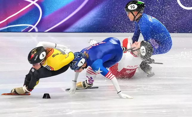 Kamila Sellier of Poland falls during a short track speed skating women's 1500 meters quarterfinal at the 2026 Winter Olympics, in Milan, Italy, Feb. 20, 2026. (AP Photo/Stephanie Scarbrough, File)