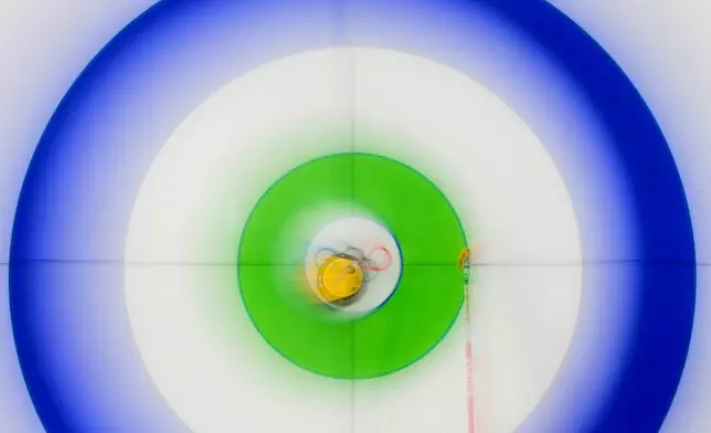 Switzerland's Silvana Tirinzoni competes against Denmark during the women's curling round robin session at the 2026 Winter Olympics, in Cortina d'Ampezzo, Italy, Feb. 18, 2026. (AP Photo/Christophe Ena, File)