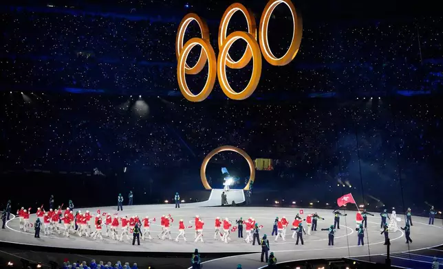Athletes from Switzerland walk during the Olympic opening ceremony at the 2026 Winter Olympics, in Milan, Italy, Feb. 6, 2026. (AP Photo/Lee Jin-man, File)