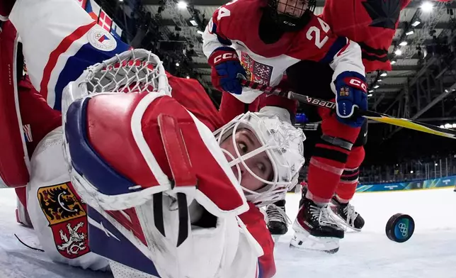 Czechia's Michaela Hesova looks on as Canada's Julia Gosling scores her side's fourth goal during a preliminary round match of women's ice hockey between Canada and Czechia at the 2026 Winter Olympics, in Milan, Italy, Feb. 9, 2026. (AP Photo/Darko Bandic, Pool, File)
