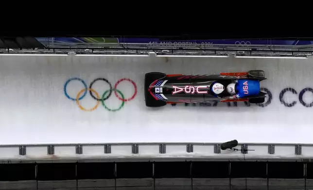 United States' Frankie del Duca and Joshua Williamson slide down the track during a two man bobsled run at the 2026 Winter Olympics, in Cortina d'Ampezzo, Italy, Tuesday, Feb. 17, 2026. (AP Photo/Alessandra Tarantino)