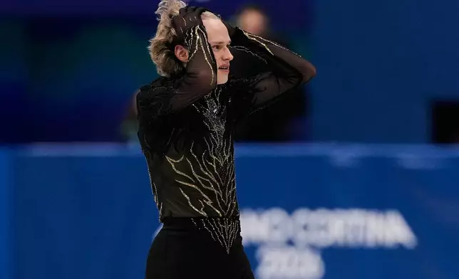 Ilia Malinin of the United States competes during the men's free skate program in figure skating at the 2026 Winter Olympics, in Milan, Italy, Friday, Feb. 13, 2026. (AP Photo/Ashley Landis)