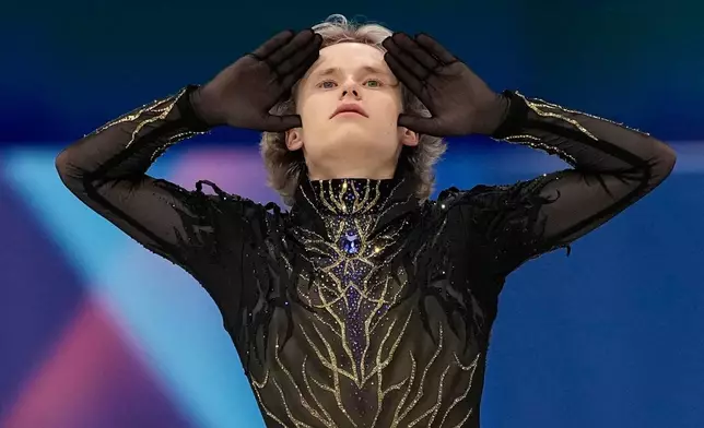 Ilia Malinin of the United States competes during the men's free skate program in figure skating at the 2026 Winter Olympics, in Milan, Italy, Friday, Feb. 13, 2026. (AP Photo/Ashley Landis)