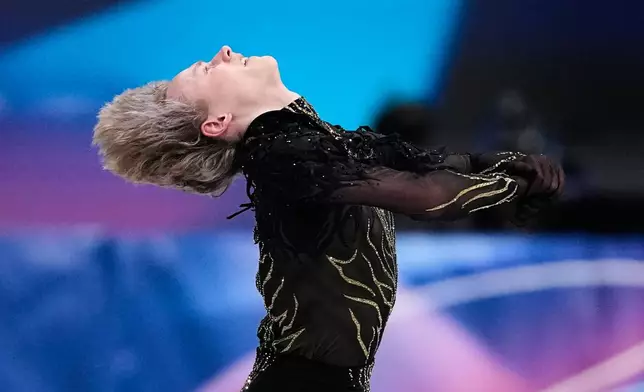 Ilia Malinin of the United States competes during the men's free skate program in figure skating at the 2026 Winter Olympics, in Milan, Italy, Friday, Feb. 13, 2026. (AP Photo/Natacha Pisarenko)