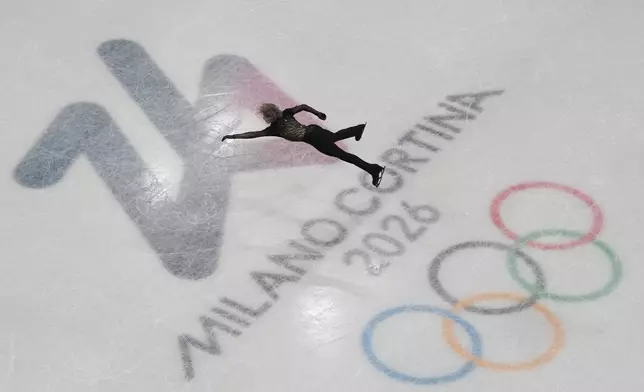 Ilia Malinin of the United States competes during the men's free skate program in figure skating at the 2026 Winter Olympics, in Milan, Italy, Friday, Feb. 13, 2026. (AP Photo/Christophe Ena)