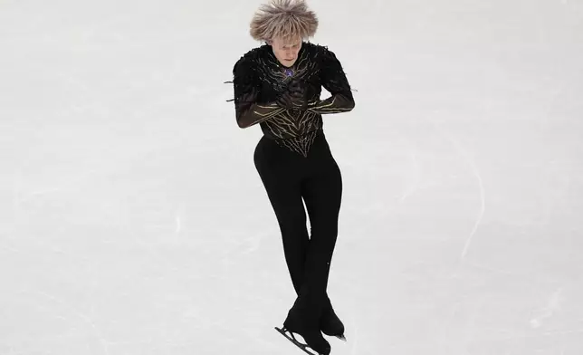 Ilia Malinin of the United States competes during the men's free skate program in figure skating at the 2026 Winter Olympics, in Milan, Italy, Friday, Feb. 13, 2026. (AP Photo/Francisco Seco)