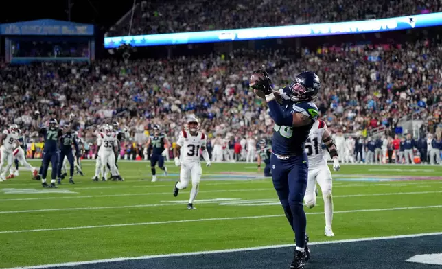 Seattle Seahawks tight end AJ Barner catches a touchdown pass during the second half of the NFL Super Bowl 60 football game against the New England Patriots, Sunday, Feb. 8, 2026, in Santa Clara, Calif. (AP Photo/Brynn Anderson)