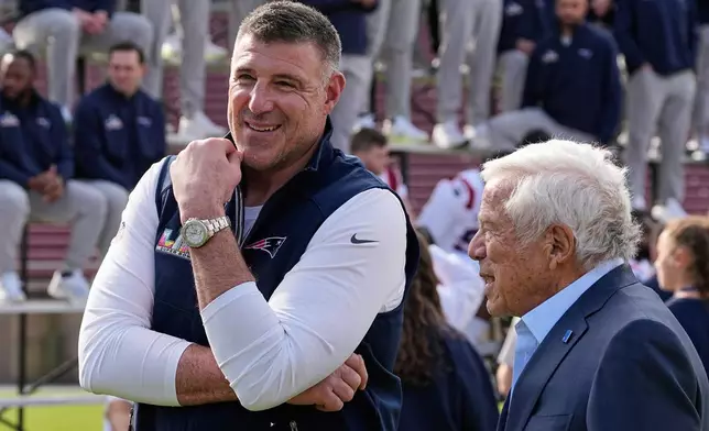 New England Patriots head coach Mike Vrabel, left, talks with team owner Robert Kraft at the practice venue for their Super Bowl 60 NFL football game against the Seattle Seahawks, Saturday, Feb. 7, 2026, in Stanford, Calif. (AP Photo/Charlie Riedel)
