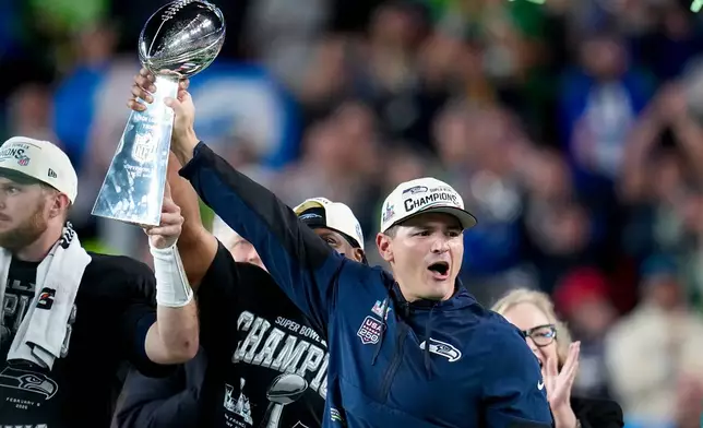 Seattle Seahawks head coach Mike MacDonald hold the Lombardi Trophy after defeating the New England Patriots the NFL Super Bowl 60 football game, Sunday, Feb. 8, 2026, in Santa Clara, Calif. (AP Photo/Sue Ogrocki)