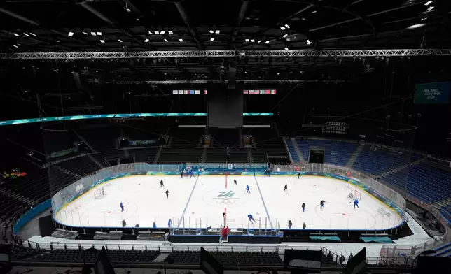 France's men hockey players take part in a training session ahead of the 2026 Winter Olympics in Milan, Italy, Tuesday, Feb. 3, 2026. (AP Photo/Hassan Ammar)