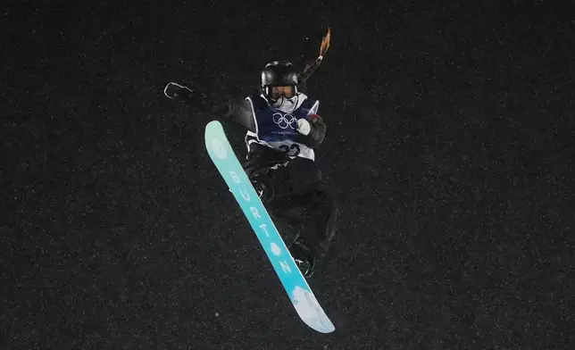 China's Zhang Xiaonan practices during a snowboard big air training session at the 2026 Winter Olympics, in Livigno, Italy, Wednesday, Feb. 4, 2026. (AP Photo/Lindsey Wasson)