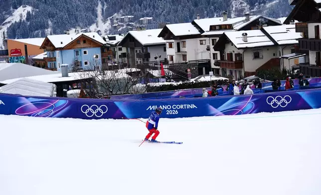 Liechtenstein's Marco Pfiffner gets to the finish area, during the alpine ski, men's downhill first official training, at the 2026 Winter Olympics, in Bormio, Italy, Wednesday, Feb. 4, 2026. (AP Photo/Pier Marco Tacca)