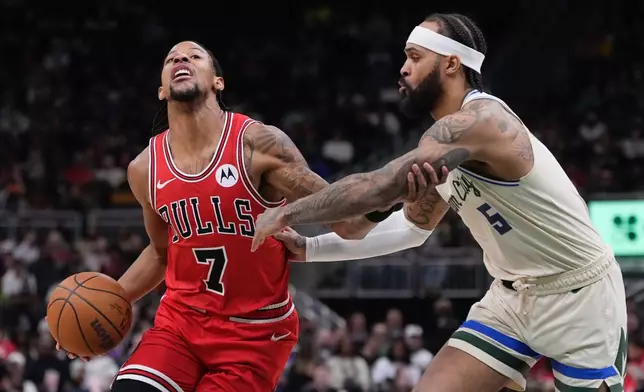 Chicago Bulls' Dalen Terry tries to get past Milwaukee Bucks' Gary Trent Jr. during the first half of an NBA basketball game Tuesday, Feb. 3, 2026, in Milwaukee. (AP Photo/Morry Gash)
