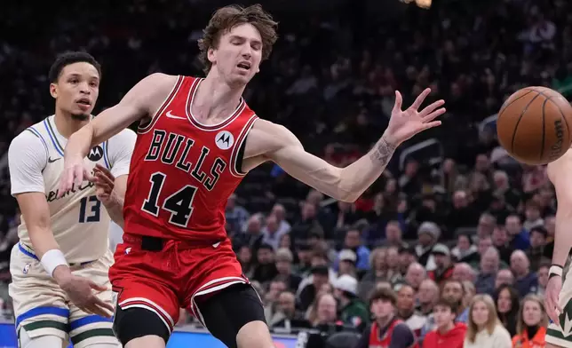 Milwaukee Bucks' Ryan Rollins knocks the ball from Chicago Bulls' Matas Buzelis during the first half of an NBA basketball game Tuesday, Feb. 3, 2026, in Milwaukee. (AP Photo/Morry Gash)