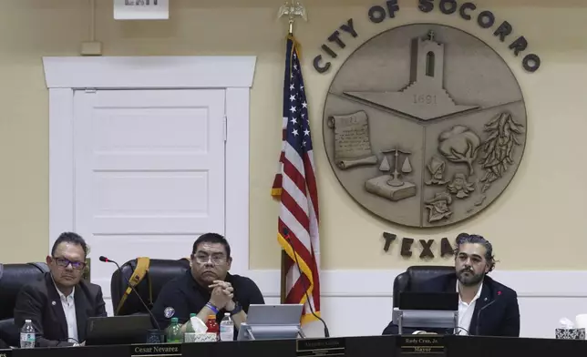 Mayor Rudy Cruz Jr., right, listens to public comments at a City Council meeting on Wednesday, Feb. 11, 2026, in Socorro, Texas, regarding the purchase of three hulking warehouses in connection with U.S. Immigration and Customs Enforcement's expansion of immigrant detention centers. (AP Photo/Morgan Lee)