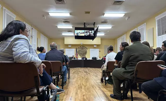 A public comment session takes place at a City Council meeting on Wednesday, Feb. 11, 2026, in Socorro, Texas, regarding the purchase of three hulking warehouses in connection with U.S. Immigration and Customs Enforcement's expansion of immigrant detention centers. (AP Photo/Morgan Lee)