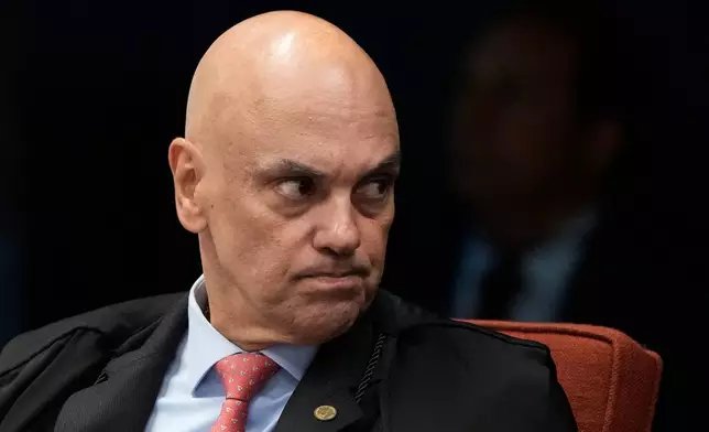 Judge Alexandre de Moraes attends the first day of trial of those accused of ordering the murder of councilwoman Marielle Franco at the Supreme Court in Brasilia, Brazil, Tuesday, Feb. 24, 2026. (AP Photo/Eraldo Peres)