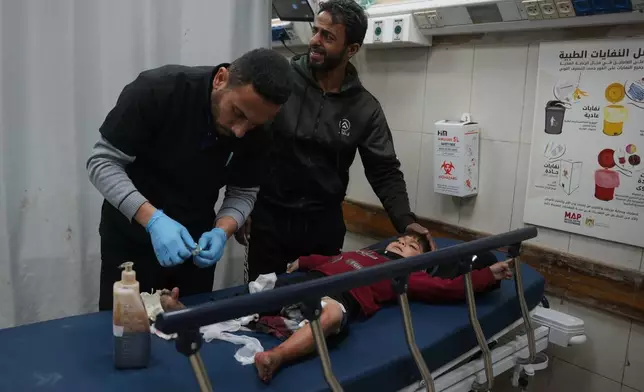 An injured child is treated at Nasser Hospital, following an Israeli military strike in Khan Younis, Gaza Strip, Friday, Feb. 27, 2026. (AP Photo/Abdel Kareem Hana)